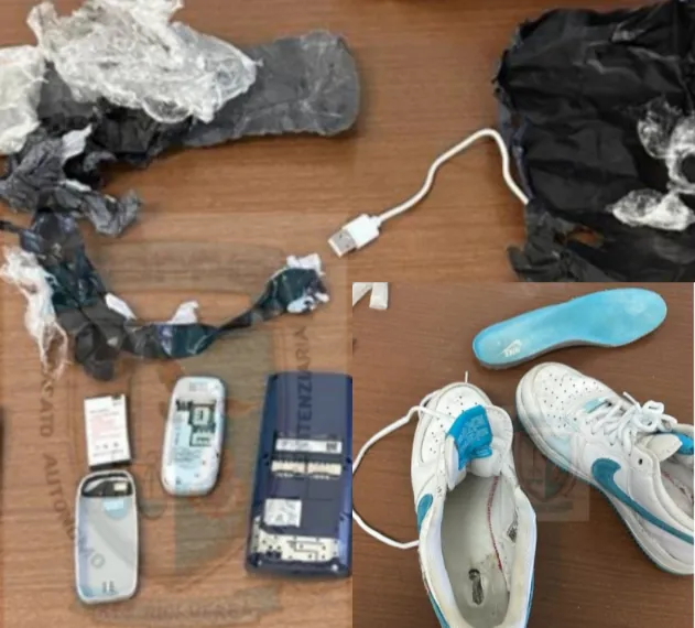Nasconde nelle Nike 2 telefoni per il marito detenuto